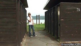 Steamy Encounter Between A Blonde Mature And A Man In A Public Restroom