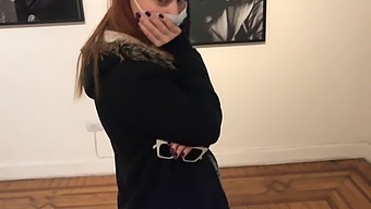 A Woman Uses A Vibrator To Enhance Her Pleasure In A Public Setting
